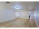 Open-concept living room with ample space and views into the kitchen at 1125 E Milada Dr, Phoenix, AZ 85042
