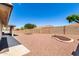 Large backyard with decorative rock and desert landscaping, perfect for low-maintenance living at 11510 E Lomita Ave, Mesa, AZ 85209