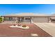 Charming single-story home with desert landscaping, a two-car garage, and a neutral color palette at 11510 E Lomita Ave, Mesa, AZ 85209