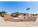 A corner lot home featuring well-maintained desert landscaping and a two-car garage at 11510 E Lomita Ave, Mesa, AZ 85209