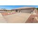 Corner lot home with desert landscaping, complemented by a spacious driveway at 11510 E Lomita Ave, Mesa, AZ 85209