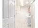 Bright laundry room featuring tile floors, shelving, and modern washer and dryer at 11510 E Lomita Ave, Mesa, AZ 85209