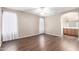 Large room showcases vinyl flooring, ample natural light, and en-suite bath at 11510 E Lomita Ave, Mesa, AZ 85209