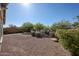 The desert landscaping in this backyard gives it a natural, serene look at 12679 W Lowden Rd, Peoria, AZ 85383
