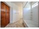 Bright bathroom with tile floors, shower, large cabinets and a window for natural light at 12679 W Lowden Rd, Peoria, AZ 85383