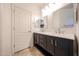 Modern bathroom features double sinks with sleek fixtures and stylish lighting at 12679 W Lowden Rd, Peoria, AZ 85383