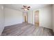 Large bedroom with wood floors, ceiling fan, archway and bright natural light at 12679 W Lowden Rd, Peoria, AZ 85383