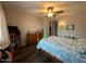 Cozy bedroom features a ceiling fan, wood floors, and plenty of natural light at 12679 W Lowden Rd, Peoria, AZ 85383