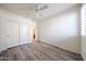 Inviting bedroom featuring wood floors, closet and bright natural light at 12679 W Lowden Rd, Peoria, AZ 85383