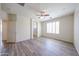 Spacious bedroom with wood floors, ceiling fan, and bright natural light at 12679 W Lowden Rd, Peoria, AZ 85383
