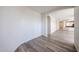 Open living room with wood floors and archways for seamless entertaining at 12679 W Lowden Rd, Peoria, AZ 85383