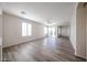 Open living room featuring wood-look floors and sliding glass doors that allow lots of light at 12679 W Lowden Rd, Peoria, AZ 85383