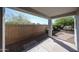 This covered patio looks out onto the landscaped yard, complete with brick accents at 12679 W Lowden Rd, Peoria, AZ 85383