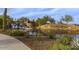 Beautiful Vistancia entrance with lush landscaping, a stone waterfall, and a serene water feature at 12679 W Lowden Rd, Peoria, AZ 85383