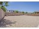 Expansive, zero-scaped backyard surrounded by privacy block wall at 1343 W Roadrunner Dr, Chandler, AZ 85286