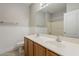 Bathroom featuring double sinks, vanity with drawers, and a shower with a curtain rod at 1343 W Roadrunner Dr, Chandler, AZ 85286
