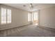 Spacious bedroom with a ceiling fan and arched doorway to the bathroom at 1343 W Roadrunner Dr, Chandler, AZ 85286