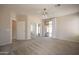 Large primary bedroom has natural light from sliding glass doors, bathroom and a mirrored closet at 1343 W Roadrunner Dr, Chandler, AZ 85286