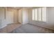 Comfortable bedroom featuring neutral carpet, shuttered windows, and an ample-sized closet at 1343 W Roadrunner Dr, Chandler, AZ 85286