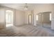 Large primary bedroom leads to bathroom, dressing area, and mirrored closet at 1343 W Roadrunner Dr, Chandler, AZ 85286