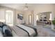 Bedroom with king bed and a view into the mirrored closet and bathroom at 1343 W Roadrunner Dr, Chandler, AZ 85286