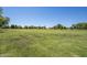 Picturesque community park with open green space and mature trees, creating a serene environment for residents at 1343 W Roadrunner Dr, Chandler, AZ 85286