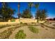 Clemente Ranch neighborhood monument sign with desert landscaping and palm trees at 1343 W Roadrunner Dr, Chandler, AZ 85286