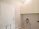 A tidy laundry room featuring cabinets and laundry hookups for convenience at 1343 W Roadrunner Dr, Chandler, AZ 85286