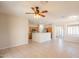 Spacious open floor plan with tile flooring, natural light, and a view into the kitchen at 1343 W Roadrunner Dr, Chandler, AZ 85286