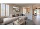 Inviting living room with neutral colors, shuttered windows, comfortable seating and backyard views at 1343 W Roadrunner Dr, Chandler, AZ 85286