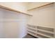 Bright walk-in closet features shelving and hanging rods at 1343 W Roadrunner Dr, Chandler, AZ 85286