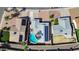 Aerial view of a home featuring a backyard pool with patio and a solar panel roof at 1511 W Mesquite St, Chandler, AZ 85224