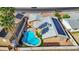 Aerial view of a home featuring a backyard pool with patio and a solar panel roof at 1511 W Mesquite St, Chandler, AZ 85224