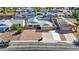 Aerial view showcases a charming single-Gathering home with a pool and solar panels in a quiet neighborhood at 1511 W Mesquite St, Chandler, AZ 85224