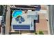 Aerial view of a home featuring a solar panel roof and backyard pool with patio at 1511 W Mesquite St, Chandler, AZ 85224