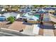 Aerial view of a single-Gathering home with a pool and solar panels in a residential neighborhood at 1511 W Mesquite St, Chandler, AZ 85224
