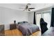 Calm bedroom featuring hardwood floors, ceiling fan, and sliding glass doors at 1511 W Mesquite St, Chandler, AZ 85224