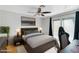 Cozy bedroom with a sliding door, ceiling fan, and neutral tones for a tranquil atmosphere at 1511 W Mesquite St, Chandler, AZ 85224