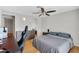 Comfortable bedroom with hardwood flooring, ceiling fan, and closet at 1511 W Mesquite St, Chandler, AZ 85224