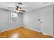 Bedroom features light walls, wood-look flooring, a ceiling fan, and a window for natural light at 1511 W Mesquite St, Chandler, AZ 85224