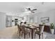 Bright dining room with a modern table, chairs, ceiling fan, and an open view to the kitchen at 1511 W Mesquite St, Chandler, AZ 85224
