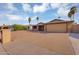 Well-maintained single-story house with a spacious driveway and low-maintenance desert landscaping at 1511 W Mesquite St, Chandler, AZ 85224