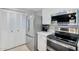 Bright kitchen featuring white cabinets, stainless steel appliances, and tile flooring at 1511 W Mesquite St, Chandler, AZ 85224