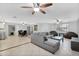 Spacious living room featuring neutral tones, tile flooring, and modern ceiling fans for comfort at 1511 W Mesquite St, Chandler, AZ 85224