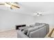 Bright living room with a comfortable sectional sofa, ceiling fans, and neutral color scheme at 1511 W Mesquite St, Chandler, AZ 85224