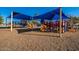 Community playground with a blue shade cover over the equipment, slide, and jungle gym at 1511 W Mesquite St, Chandler, AZ 85224