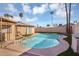 Inviting backyard oasis features a private pool, artificial grass, and mature landscaping for ultimate relaxation at 1511 W Mesquite St, Chandler, AZ 85224