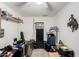 Bedroom featuring overhead lighting, neutral walls, safe, and a cowboy statue at 1602 N 73Rd Ave, Phoenix, AZ 85035