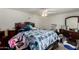 Bedroom with a ceiling fan and a bed with blue comforter at 1602 N 73Rd Ave, Phoenix, AZ 85035