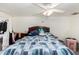 Bedroom with a bed, ceiling fan and bedside tables at 1602 N 73Rd Ave, Phoenix, AZ 85035